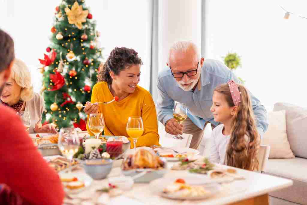 family gathered around the table having christmas 2021 12 09 06 07 16 utc