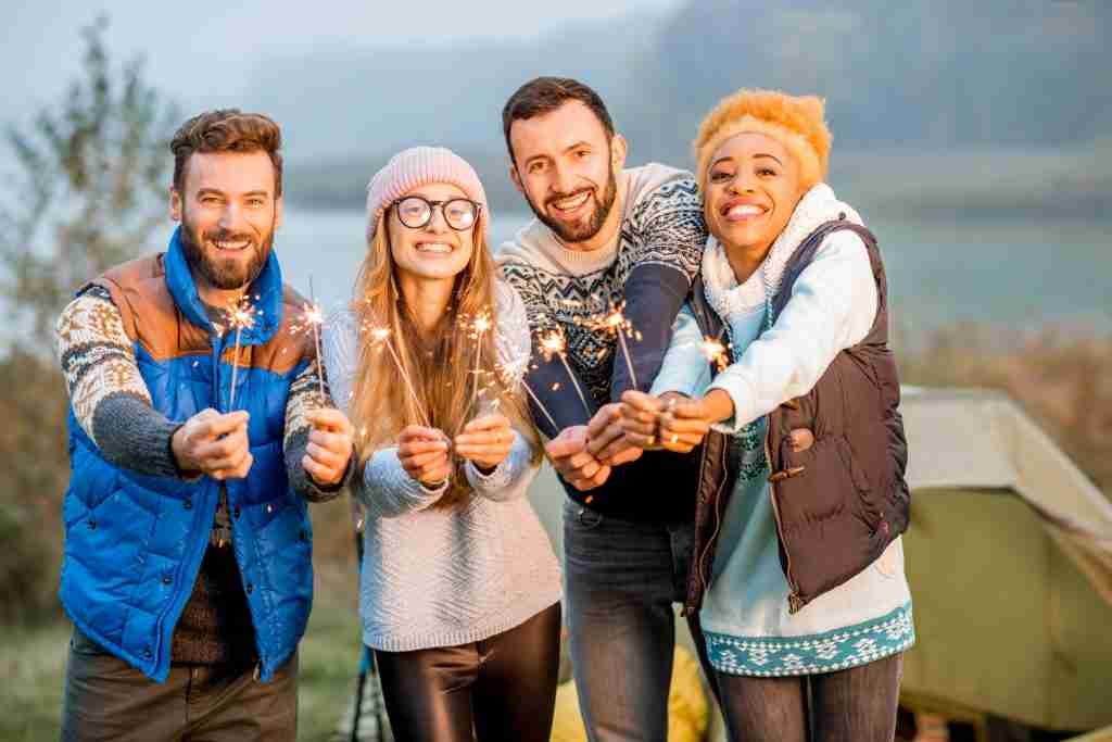 friends in sweaters celebrating at the camping 2022 04 13 17 33 38 utc