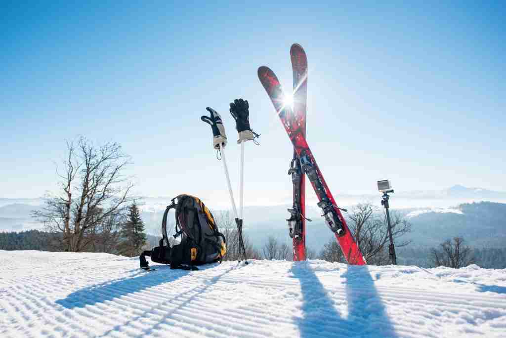 skis skiing poles and backpack on the mountain 2022 05 10 23 57 12 utc