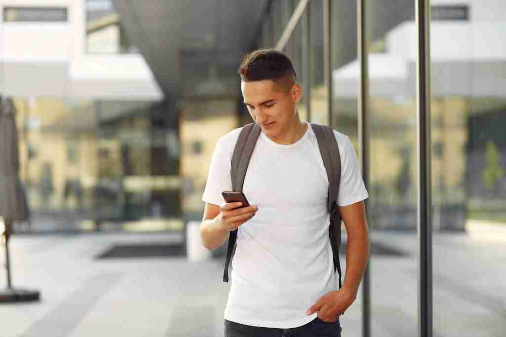 student in a university campus with a phone 2022 02 02 04 49 43 utc