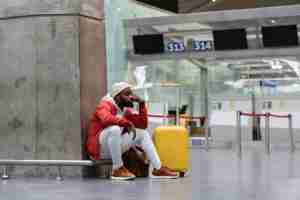 exhausted african man on a long night connection a 2022 05 11 01 44 54 utc